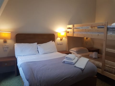 Quadruple Room | Blackout drapes, iron/ironing board, free WiFi, bed sheets