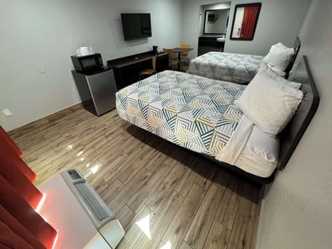 Deluxe Room, 2 Double Beds, Non Smoking, Refrigerator & Microwave | Free WiFi, bed sheets