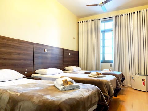 Deluxe Triple Room, 2 Bedrooms, Private Bathroom | Desk, free WiFi, bed sheets