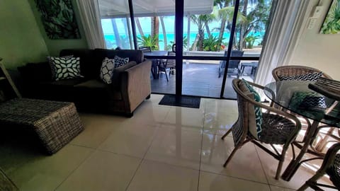 Superior Bungalow, 2 Bedrooms, Lagoon View, Beachfront | Living area | Flat-screen TV