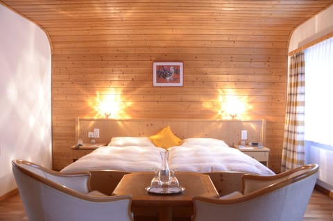 Premium bedding, down comforters, in-room safe, desk