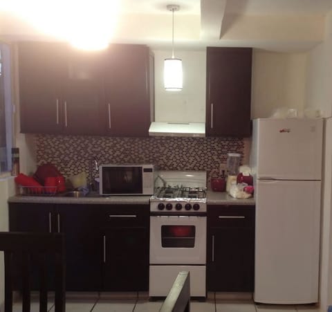 Family Townhome, 2 Bedrooms | Private kitchen | Full-size fridge, microwave, oven, stovetop