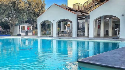 Seasonal outdoor pool, open 10:00 AM to 9:30 PM, pool umbrellas