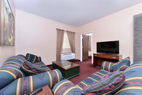 Suite, 1 King Bed, Non Smoking, Kitchenette | Desk, blackout drapes, iron/ironing board, rollaway beds