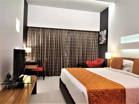 Deluxe Room | Premium bedding, minibar, in-room safe, individually decorated