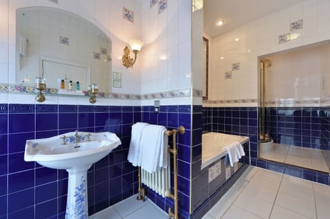 Suite, 1 King Bed (Victorian) | Bathroom | Combined shower/tub, deep soaking tub, free toiletries, hair dryer