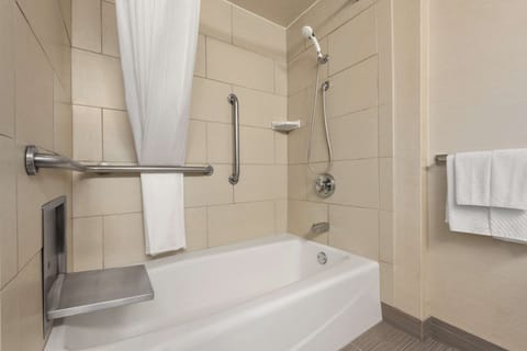 Combined shower/tub, designer toiletries, hair dryer, towels