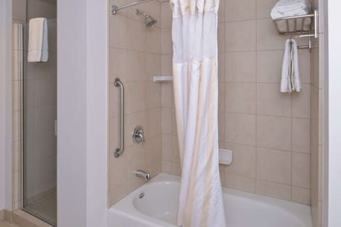 Junior Suite, 1 King Bed | Bathroom | Combined shower/tub, free toiletries, hair dryer, towels