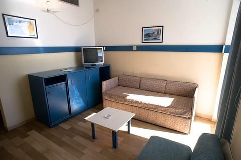 Suite, Sea View | Living area | 22-inch LCD TV with digital channels, TV