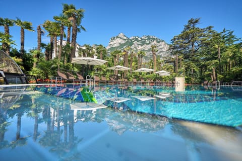 Seasonal outdoor pool, open noon to 7:00 PM, pool umbrellas