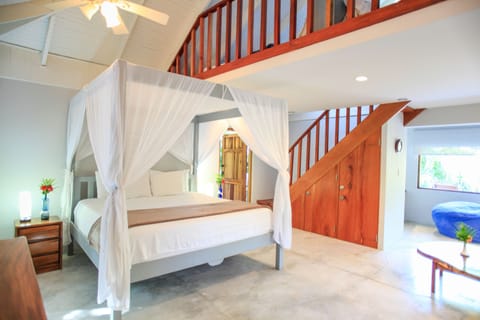 Deluxe Quadruple Room, Multiple Beds, Beachside (Casa Cassandra) | In-room safe, free WiFi, bed sheets