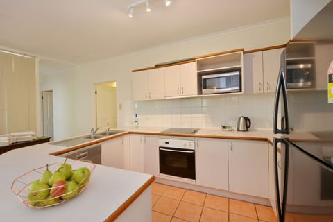 Three Bedroom Two Bathroom Apartment | Private kitchen | Fridge, microwave, oven, stovetop