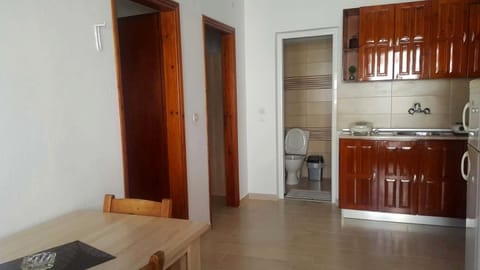 Apartment | Private kitchen | Fridge, electric kettle, toaster, cookware/dishes/utensils