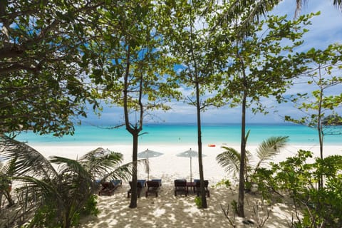 Private beach, white sand, sun loungers, beach umbrellas