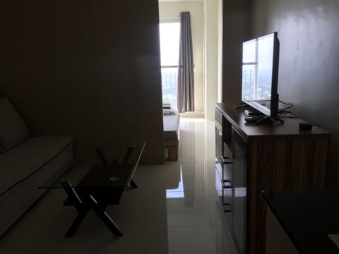 Condo, 1 Bedroom, City View | Living room | Flat-screen TV