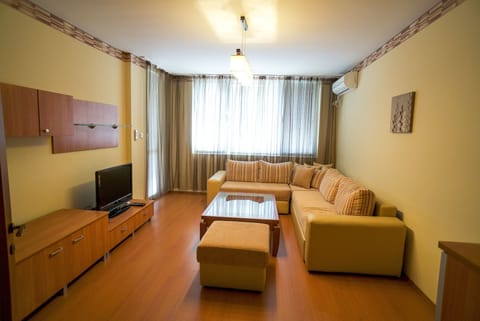 Deluxe Apartment, 2 Bedrooms, Balcony | Living room | Flat-screen TV