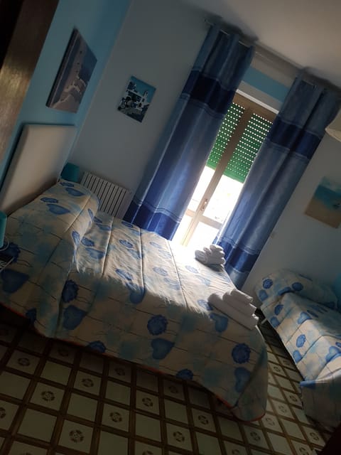 Triple Room | Blackout drapes, iron/ironing board, rollaway beds, free WiFi
