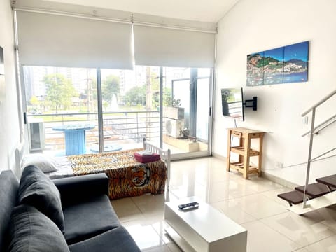 Apartment (Departamento Alassio) | Living area | Flat-screen TV