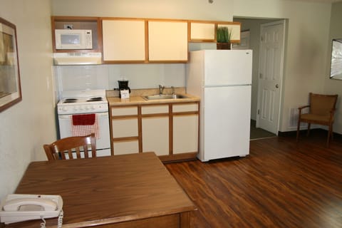 Standard Suite, 1 Queen Bed | Private kitchen | Full-size fridge, microwave, stovetop, coffee/tea maker