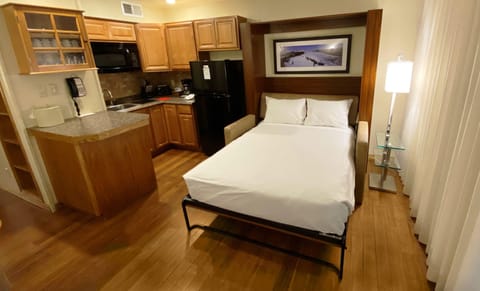 Suite, 1 Bedroom | 1 bedroom, in-room safe, blackout drapes, iron/ironing board