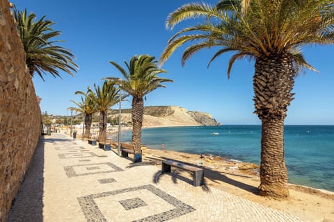 Beach nearby, white sand, beach towels