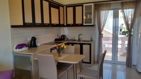 Deluxe Apartment, 1 Bedroom, Sea View | Private kitchen | Full-size fridge, oven, stovetop, coffee/tea maker