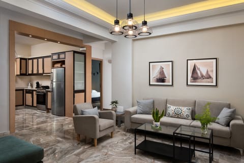 Deluxe Apartment | Living area | 43-inch flat-screen TV with satellite channels, TV