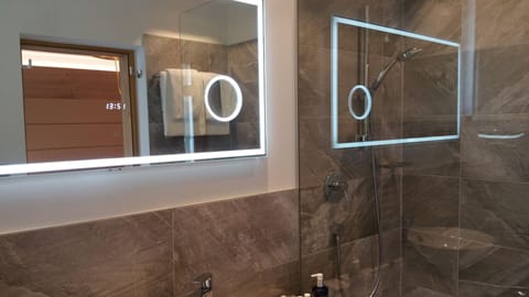 Designer toiletries, hair dryer, bathrobes, slippers