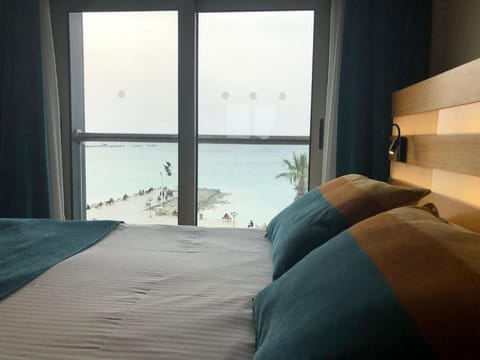 Economy Room, Sea View | Minibar, in-room safe, iron/ironing board, free WiFi