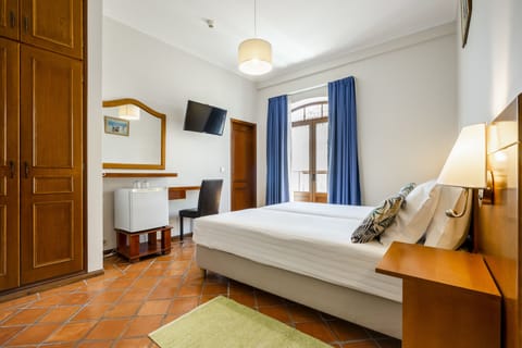 Standard Double or Twin Room | In-room safe, blackout drapes, iron/ironing board, free WiFi