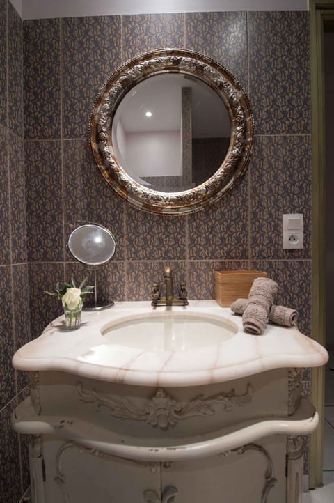 Designer toiletries, hair dryer, bathrobes, slippers