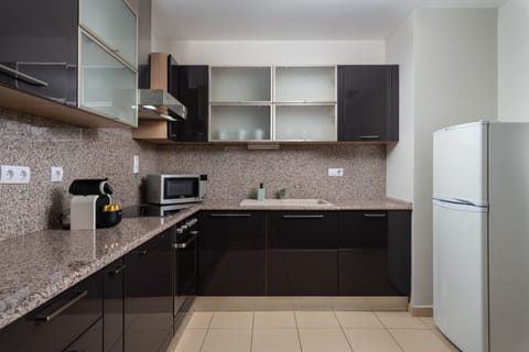 Two Bedroom Apartment 6 Adults | Private kitchen | Fridge, microwave, oven, stovetop