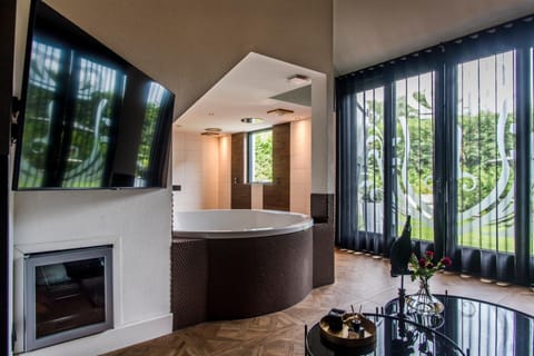 Shower, designer toiletries, hair dryer, bathrobes