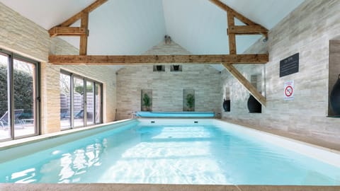 Indoor pool, open 9:30 AM to 8:00 PM, pool umbrellas, sun loungers