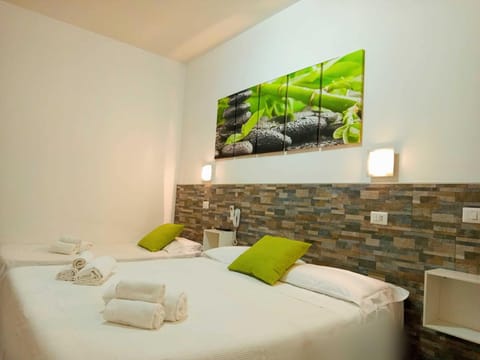 Basic Triple Room, 1 Bedroom | Down comforters, in-room safe, desk, free WiFi