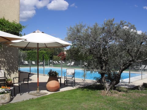 Outdoor pool, open 8 AM to 9 PM, pool umbrellas, sun loungers