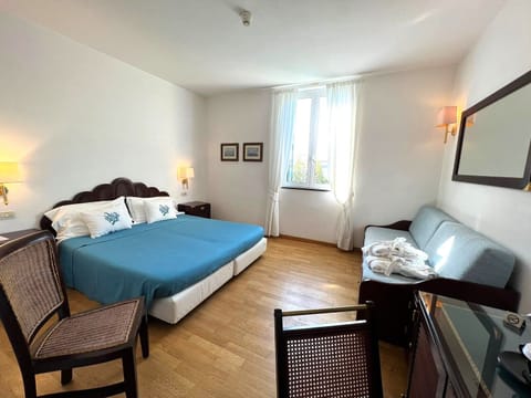 Triple Room | Down comforters, minibar, in-room safe, desk