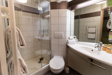 Shower, eco-friendly toiletries, hair dryer, towels