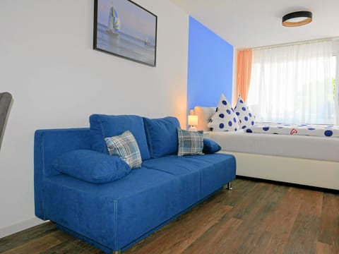 Apartment, Non Smoking, Balcony | Living area | 50-inch flat-screen TV with cable channels, TV, DVD player