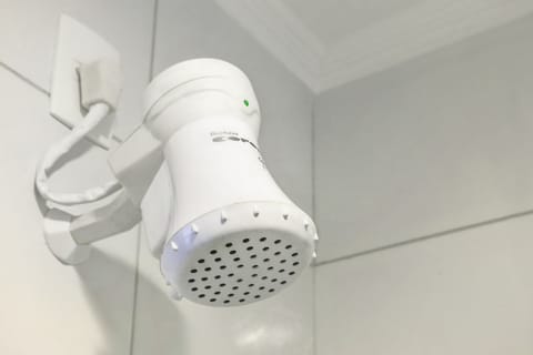 Shower, rainfall showerhead, hair dryer, towels