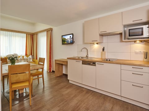 Apartment, 1 Bedroom | Private kitchen | Full-size fridge, microwave, stovetop, dishwasher