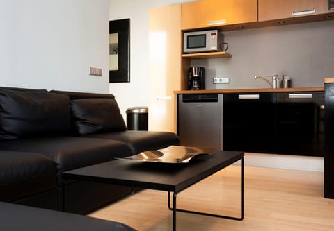 Apartment, 4 Bedrooms | Living room | Flat-screen TV