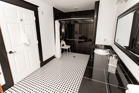 Accessible King Room, No Window | Bathroom | Hydromassage showerhead, hair dryer, bathrobes, towels