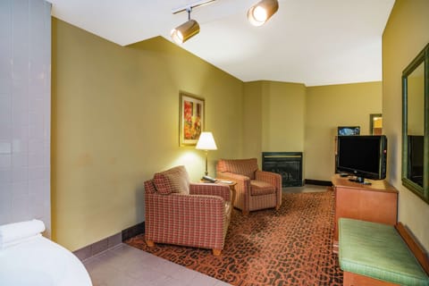 Suite, 1 King Bed, Non Smoking | In-room safe, iron/ironing board, free cribs/infant beds, rollaway beds