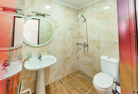 Quadruple Room, Balcony | Bathroom | Shower, free toiletries, hair dryer, slippers