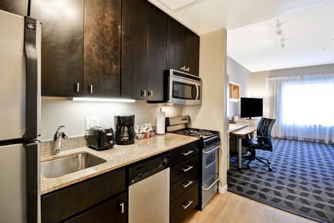 Suite, 1 Bedroom | Private kitchen | Full-size fridge, microwave, stovetop, dishwasher