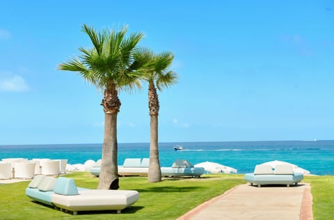 Private beach, white sand, sun loungers, beach umbrellas