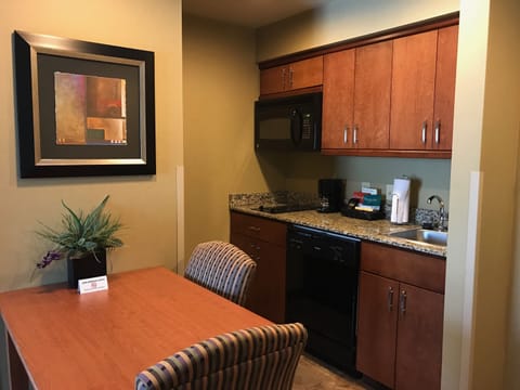 Suite, 1 King Bed, Jetted Tub | Private kitchenette | Full-size fridge, microwave, stovetop, dishwasher