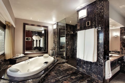 Sandton Sun Presidential Suite | Bathroom | Separate tub and shower, hydromassage showerhead, designer toiletries