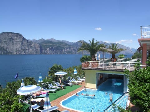 Indoor pool, seasonal outdoor pool, pool umbrellas, sun loungers